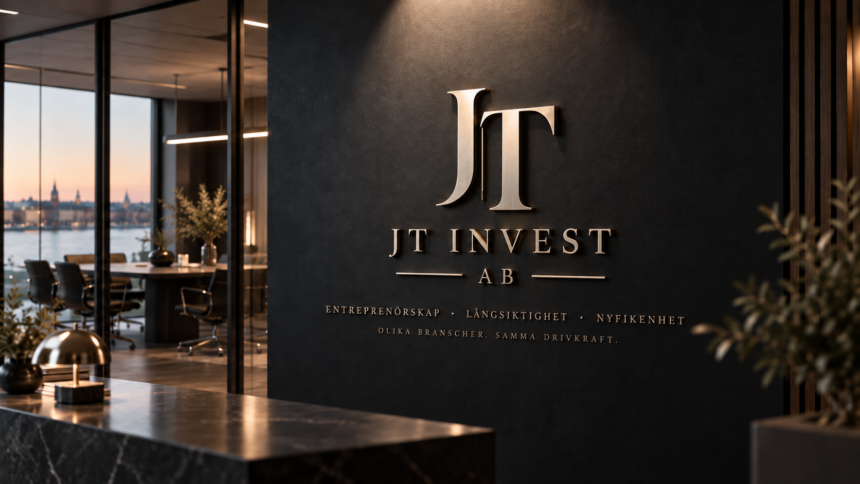 JT Invest AB:s kontorsvägg med logotyp, värdeord och slogan
